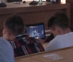 The people sitting behind you are paying to hear the speaker, not to watch you play World of Warcraft. Leave the gaming at home where it belongs.